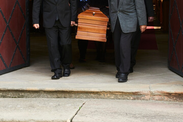 people carrying casket