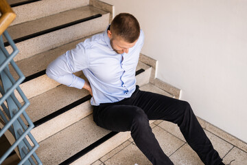 man on stairs after slip and fall