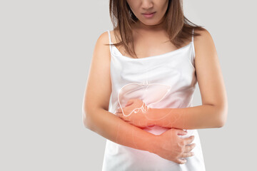 woman clutching stomach with internal injuries