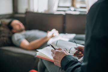 man in therapy on couch