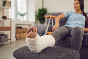 woman with broken leg on couch