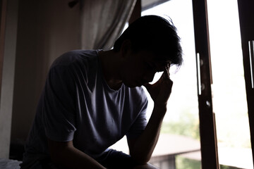 depressed man head in hands