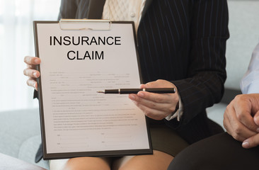 woman holding insurance claim